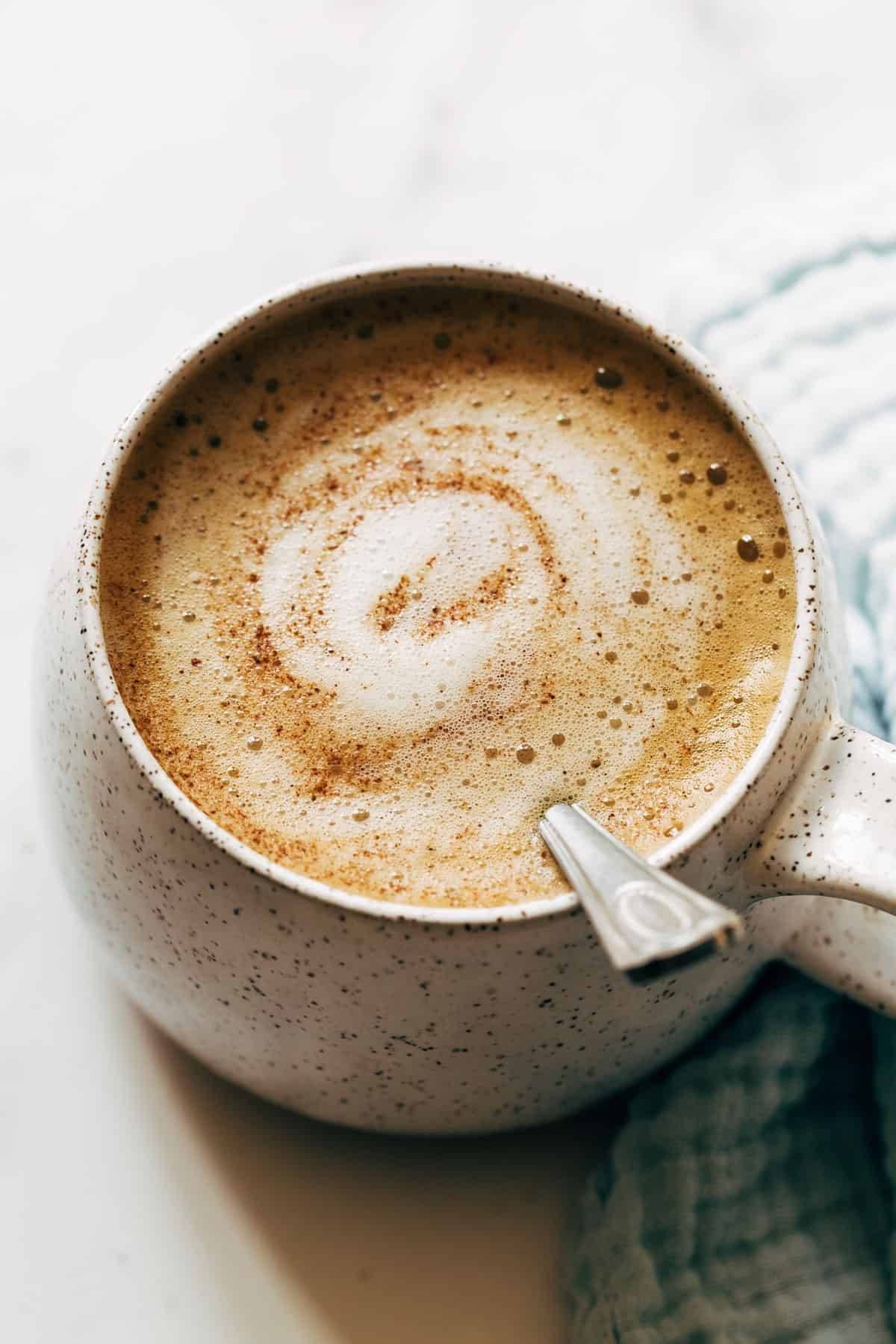 Oatmilk honey latte in a mug.