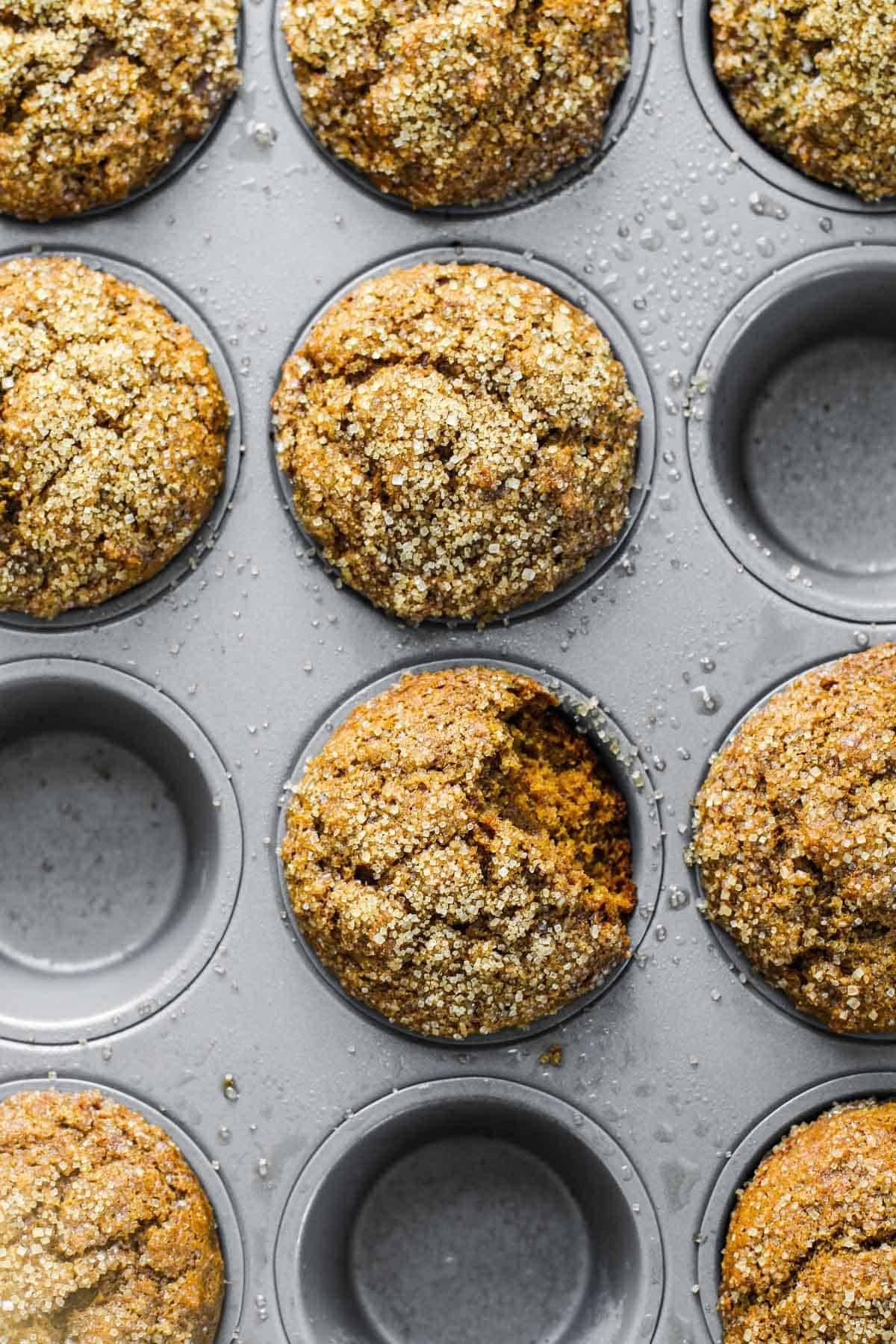 Gingerbread muffins in a muffin tin.